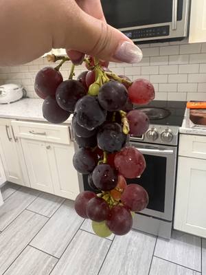 The same bunch of grapes photographed outdoors in daylight